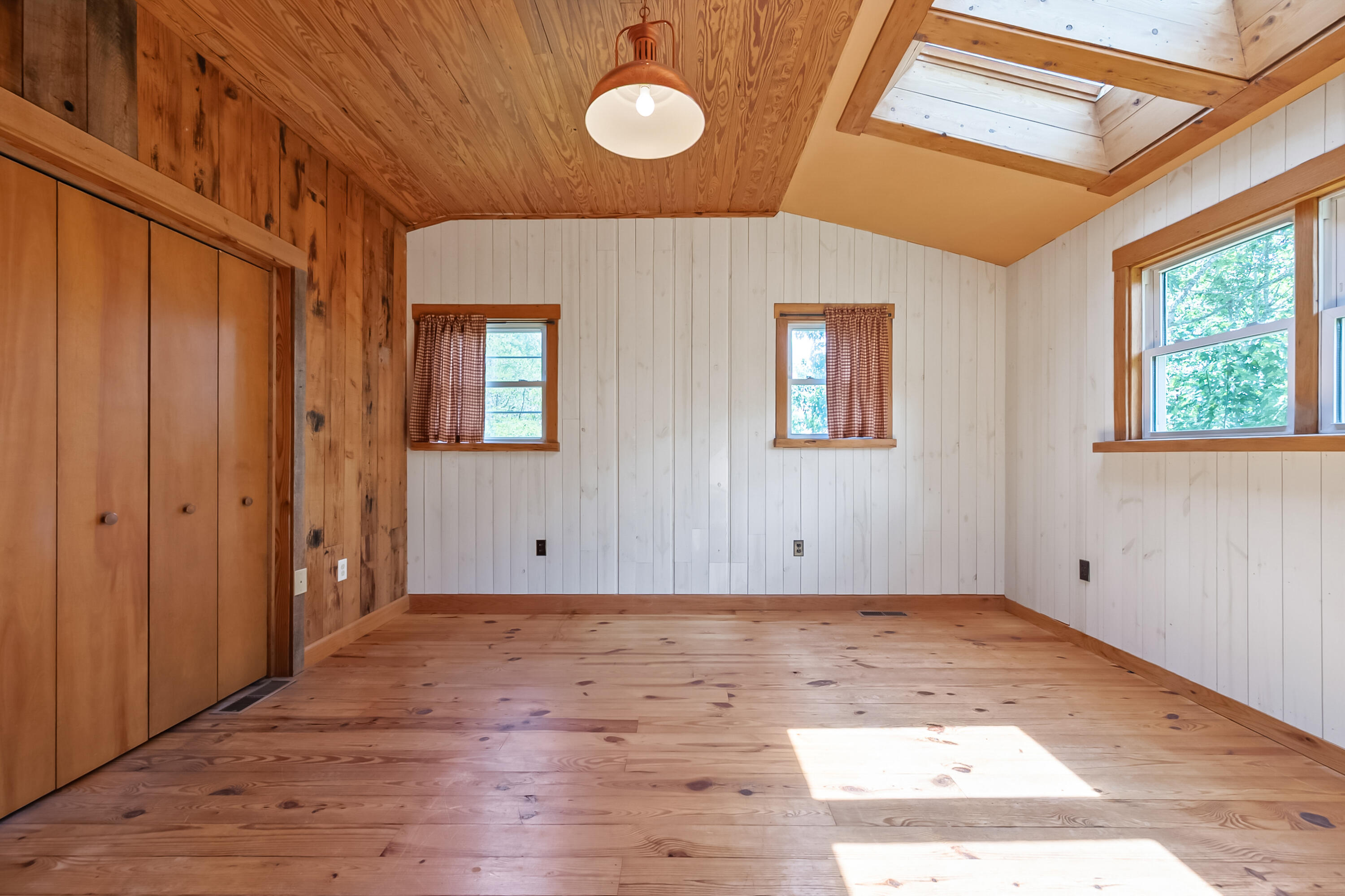 2389 Reesedale Road Elliston, VA 24087 - Photo 32 of 62 a view of an empty room with wooden floor and a window