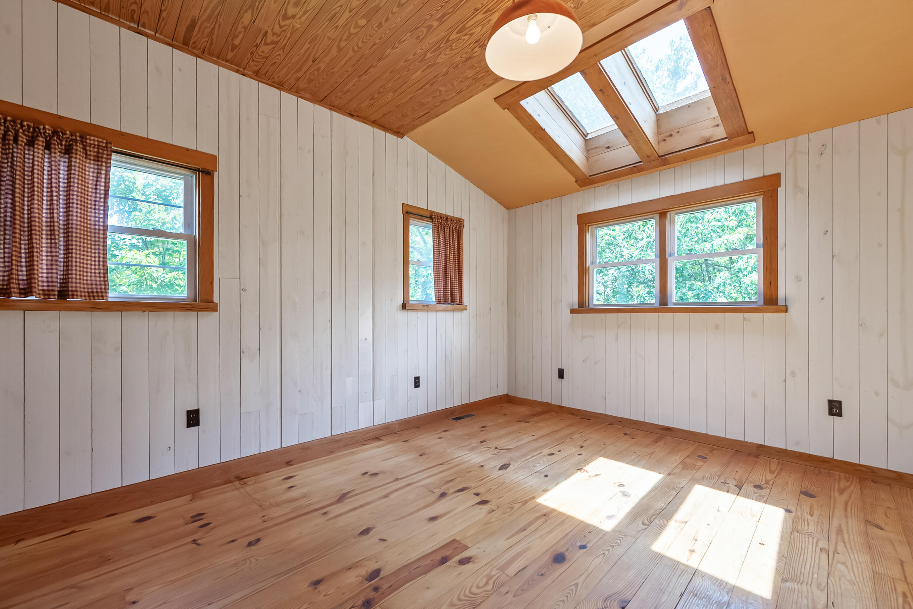 2389 Reesedale Road Elliston, VA 24087 - Photo 33 of 62 a view of empty room with wooden floor and fan