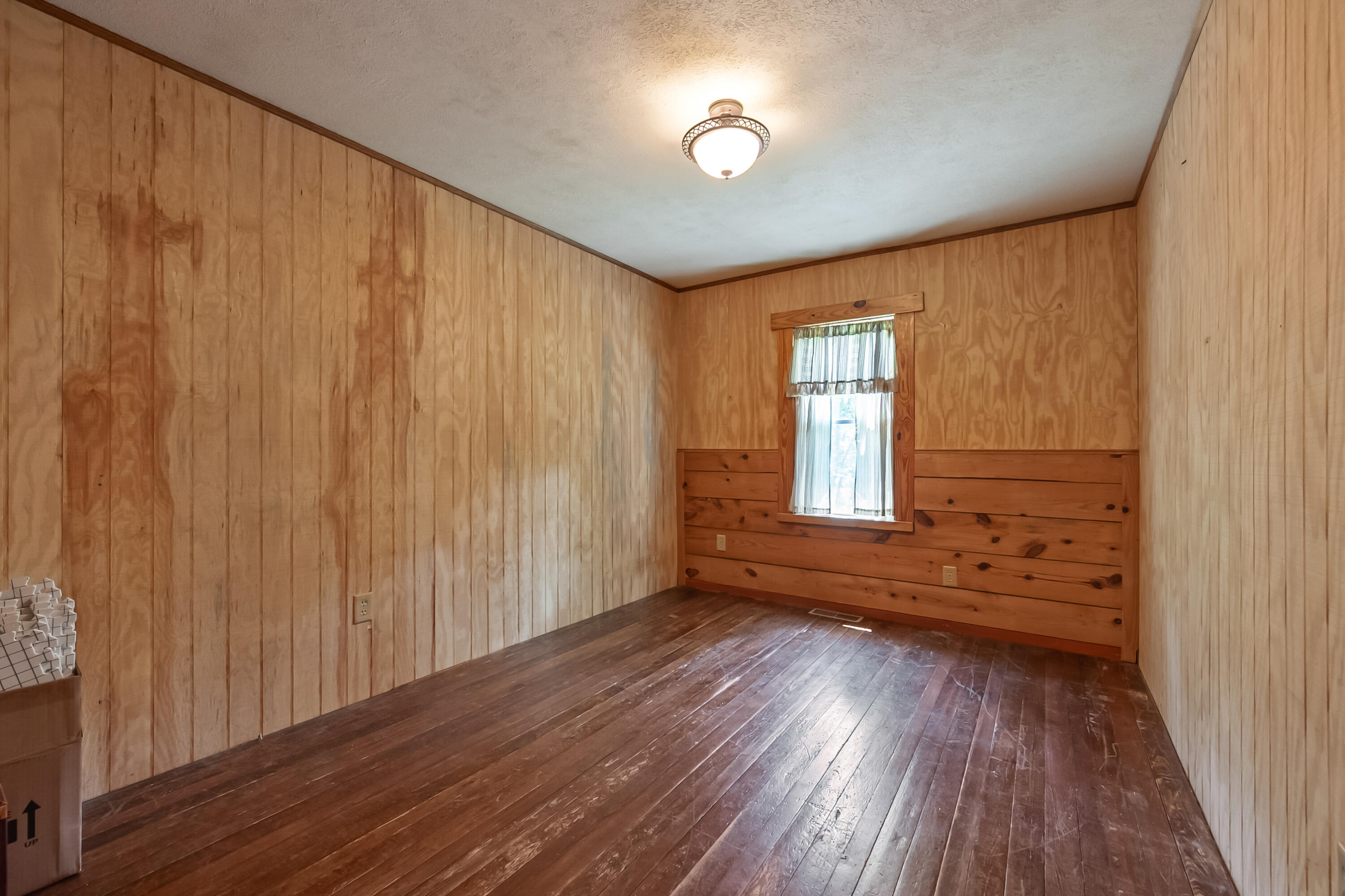 2389 Reesedale Road Elliston, VA 24087 - Photo 36 of 62 a view of empty room with wooden floor and fan
