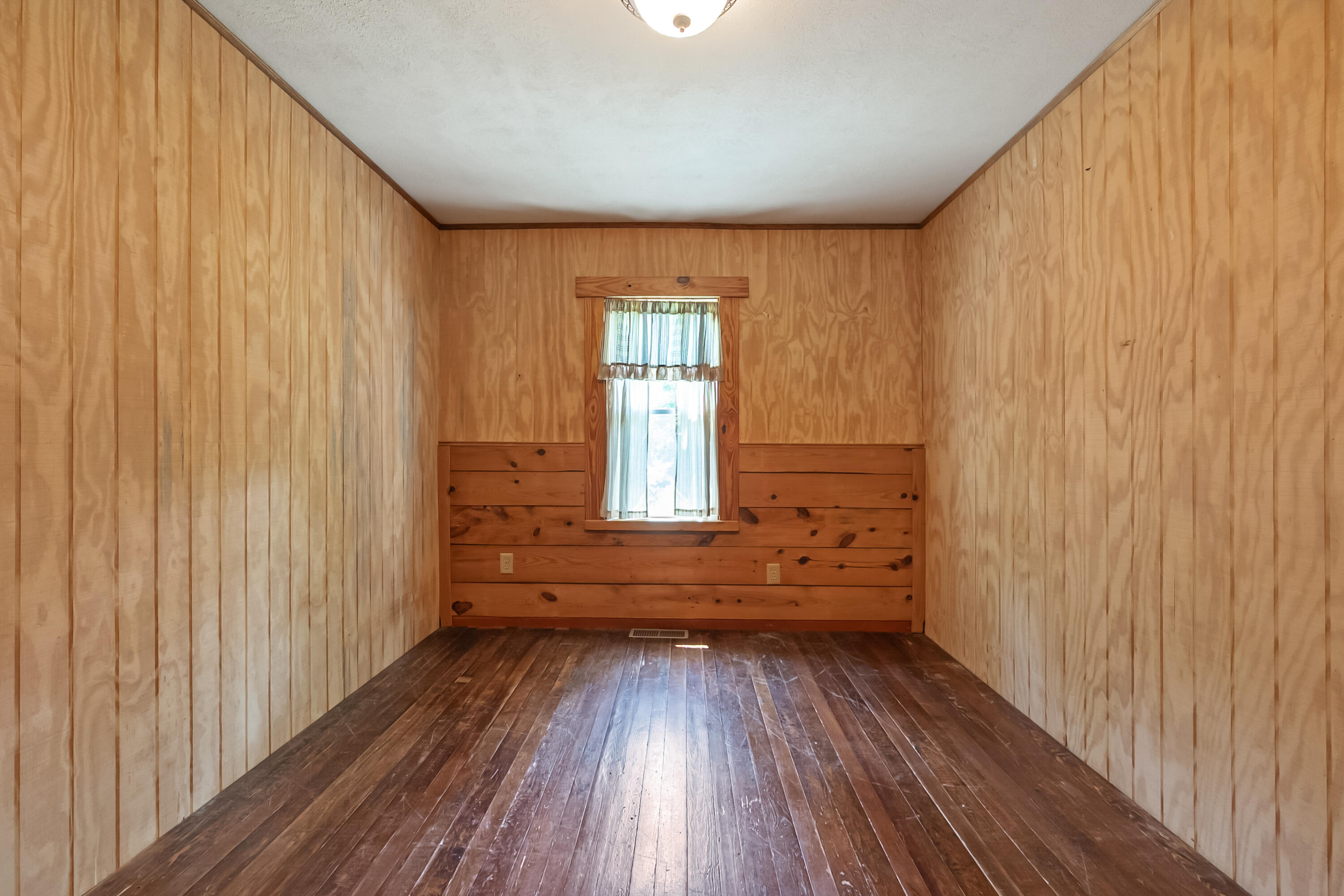2389 Reesedale Road Elliston, VA 24087 - Photo 37 of 62 a view of empty room with wooden floor and fan