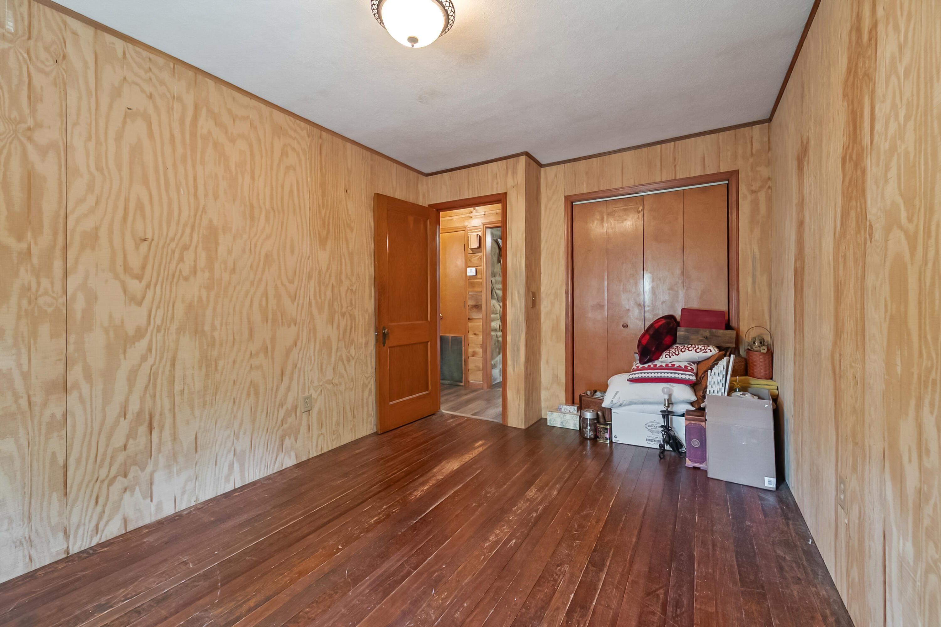 2389 Reesedale Road Elliston, VA 24087 - Photo 38 of 62 a room with wooden floor and furniture