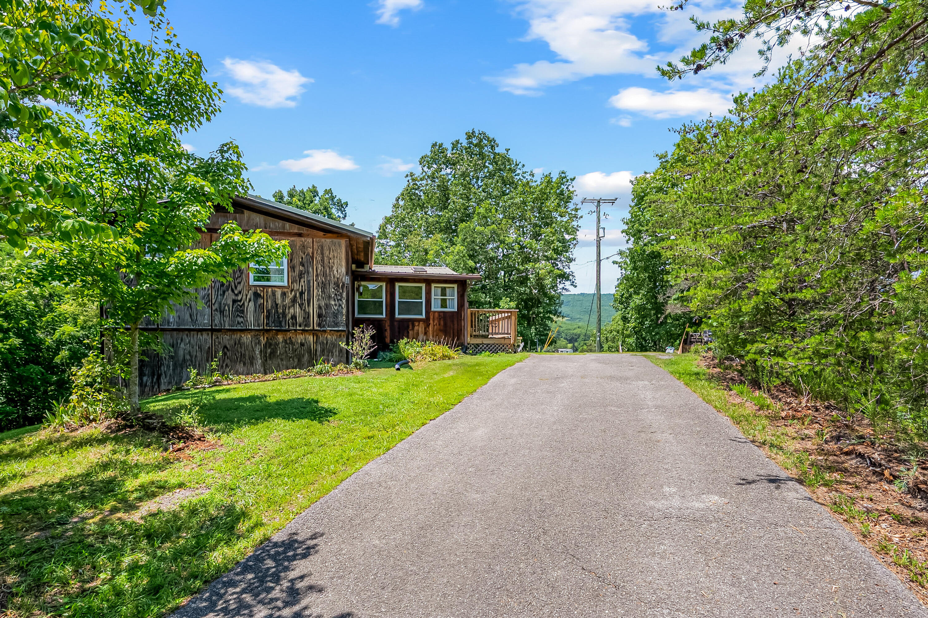2389 Reesedale Road Elliston, VA 24087 - Photo 44 of 62 a view of a house with backyard and a garden