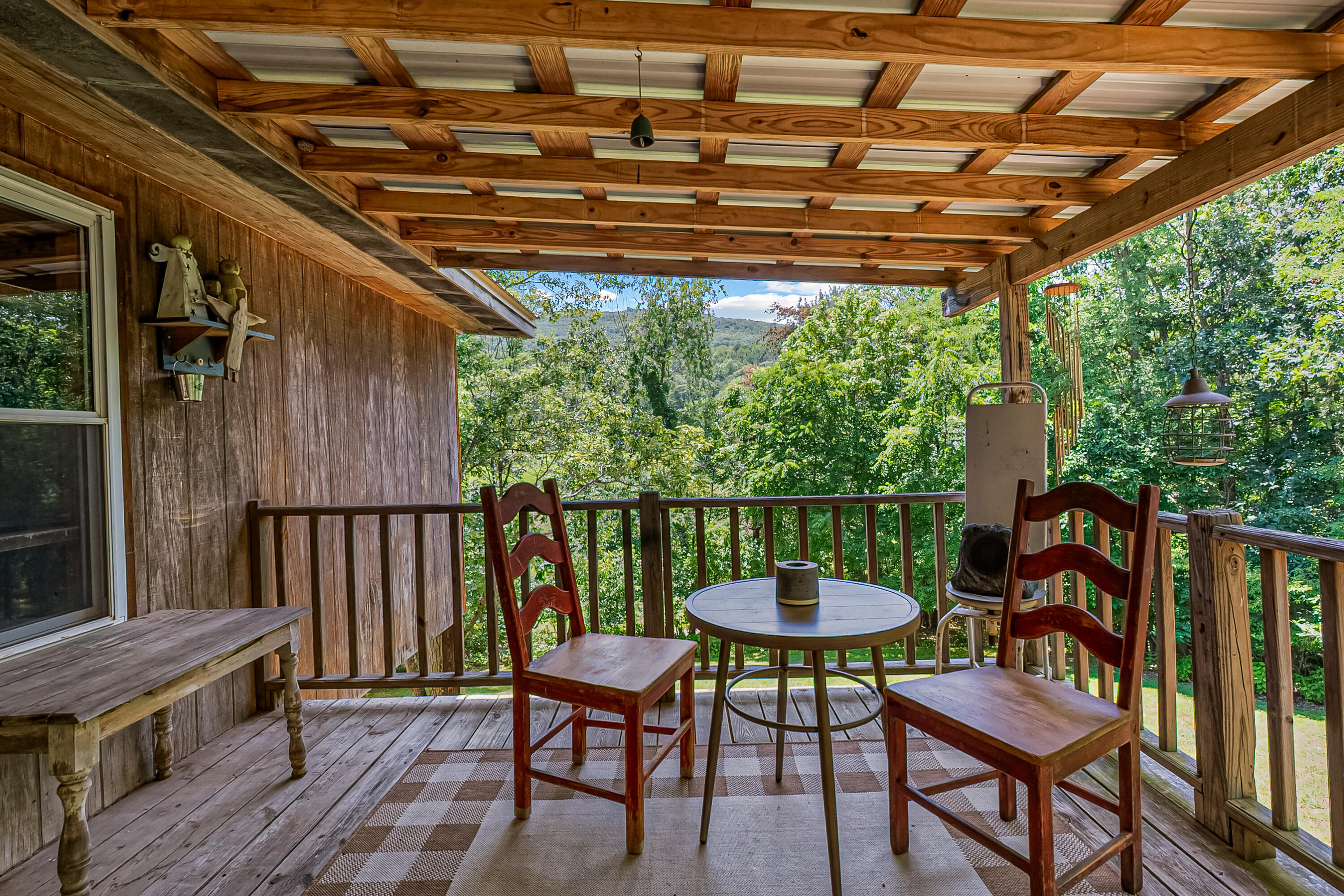 2389 Reesedale Road Elliston, VA 24087 - Photo 47 of 62 a view of a chairs and table in the patio next to a yard