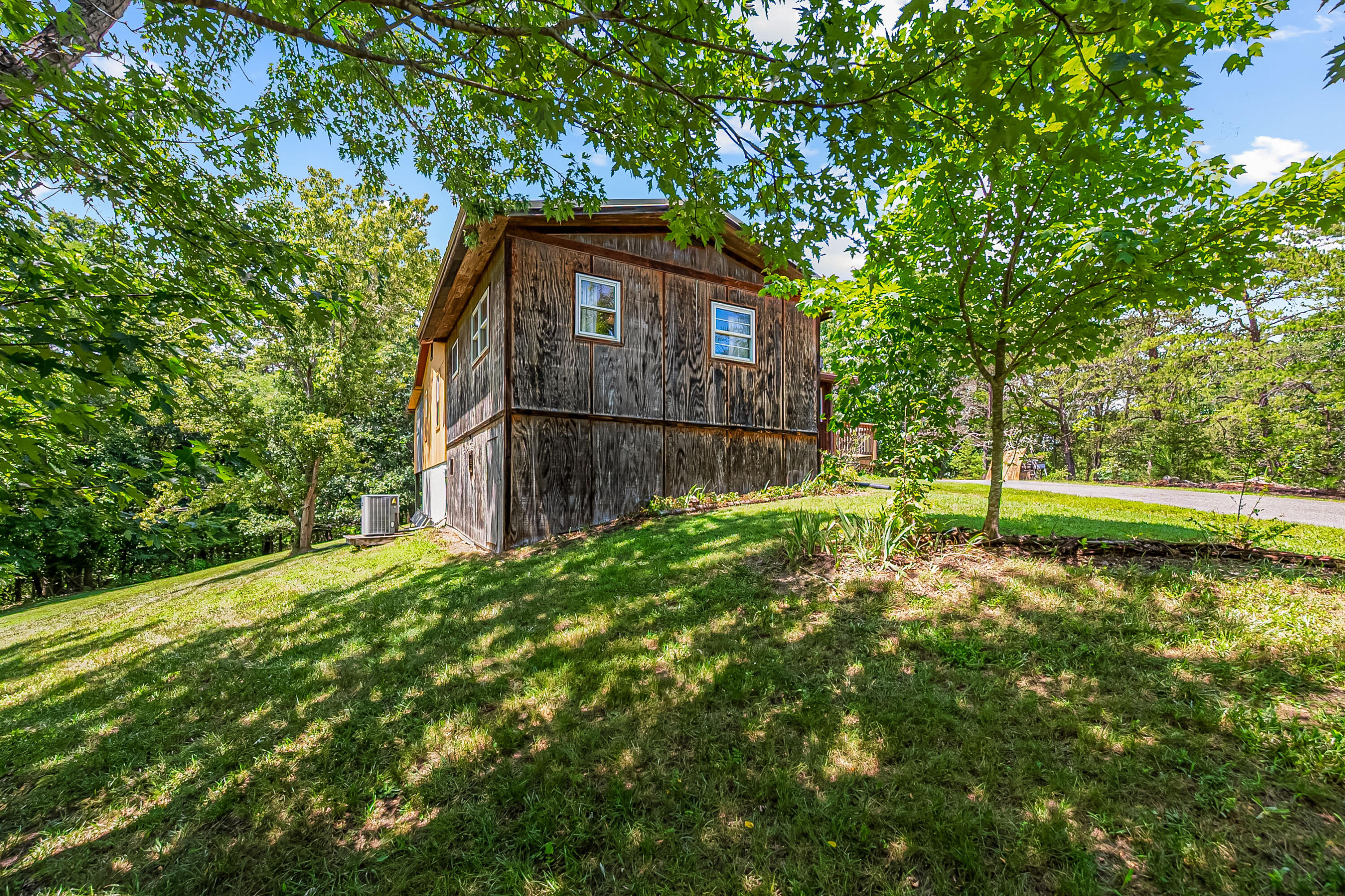 2389 Reesedale Road Elliston, VA 24087 - Photo 53 of 62 a backyard of a house with lots of green space and fountain