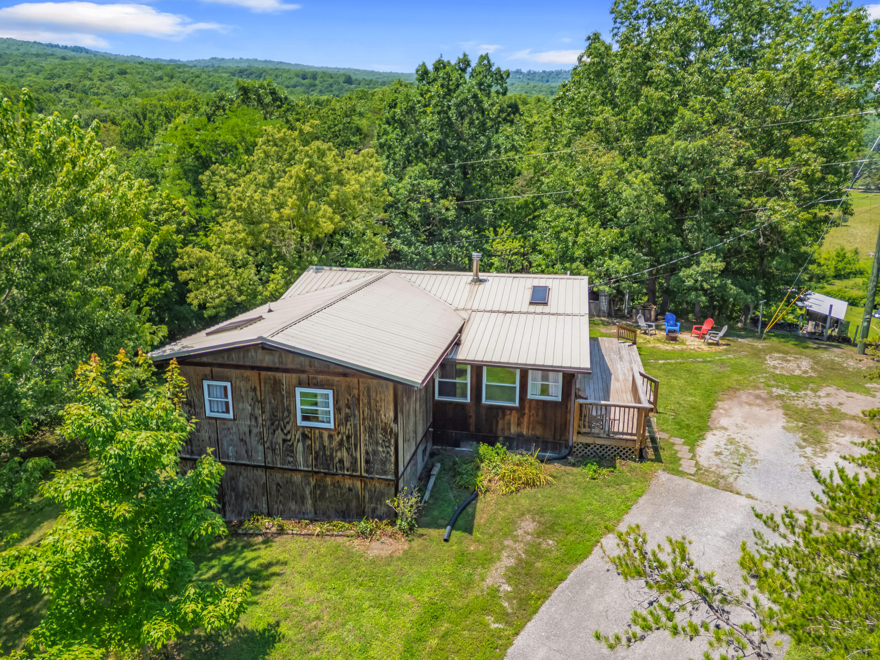 2389 Reesedale Road Elliston, VA 24087 - Photo 54 of 62 a aerial view of a house with a yard table and chairs