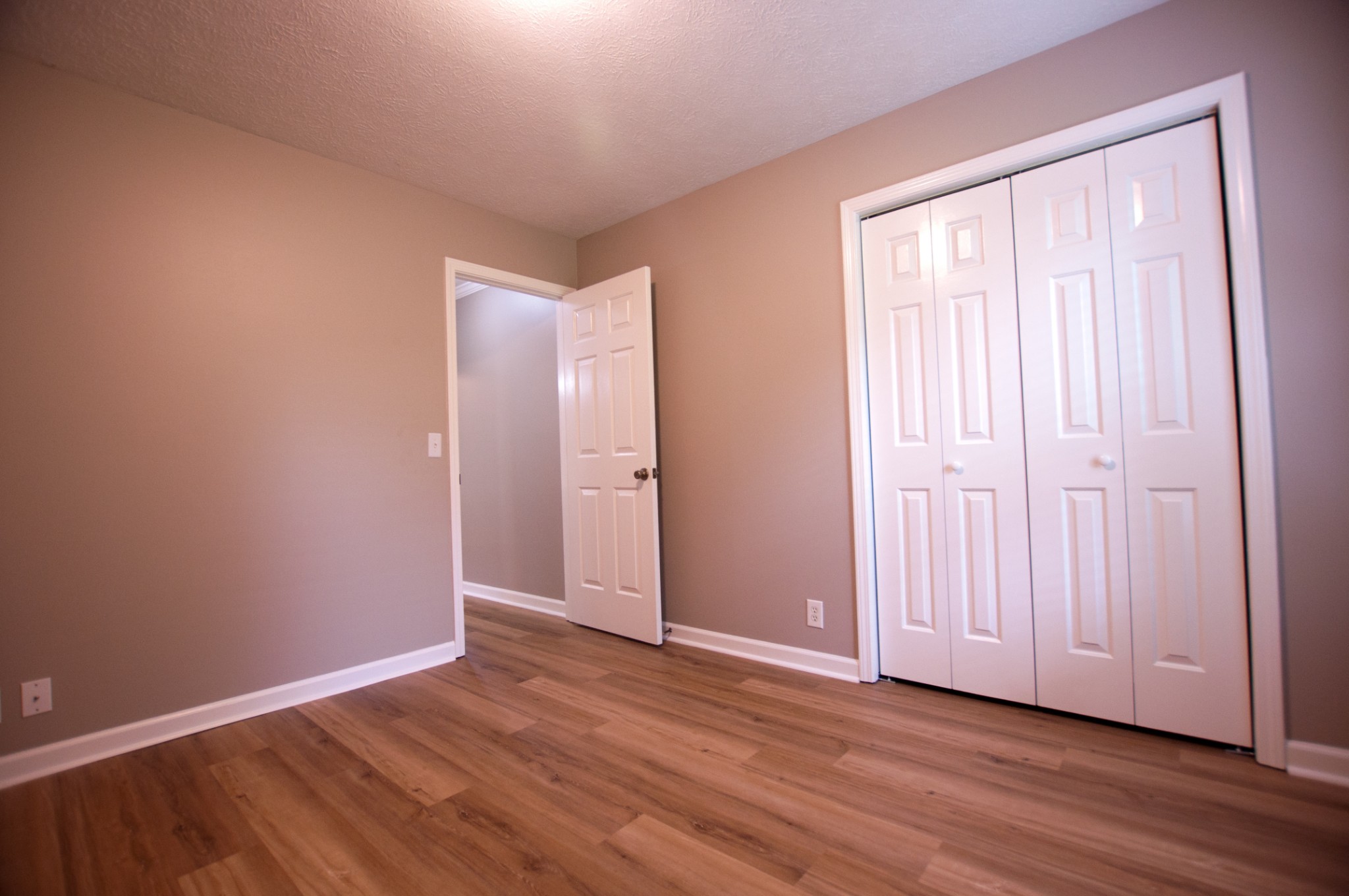 309 Chesterfield Circle Madison, TN 37115 - Photo 12 of 27 an empty room with wooden floor and windows