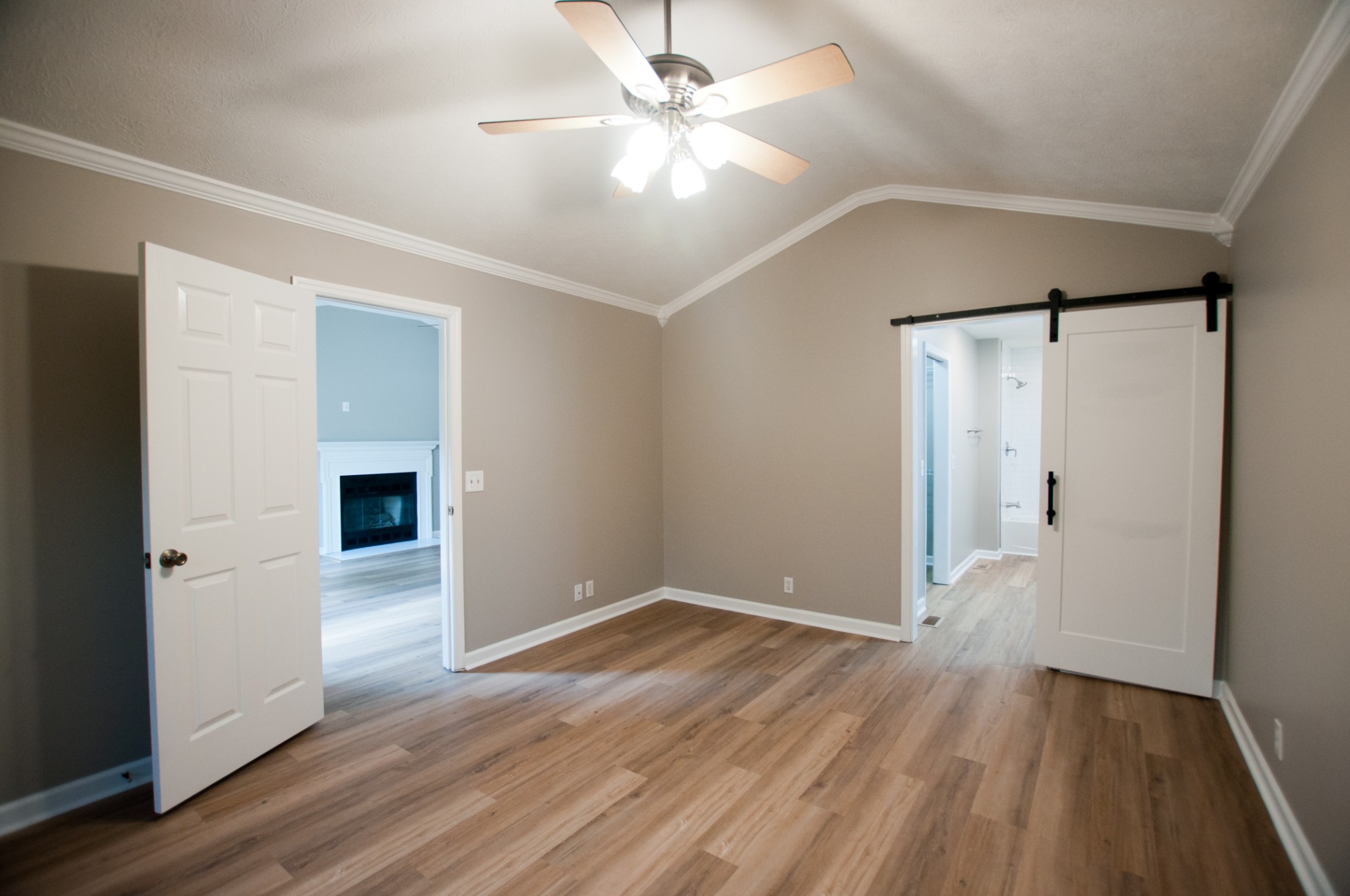 309 Chesterfield Circle Madison, TN 37115 - Photo 18 of 27 an empty room with wooden floor and a ceiling fan