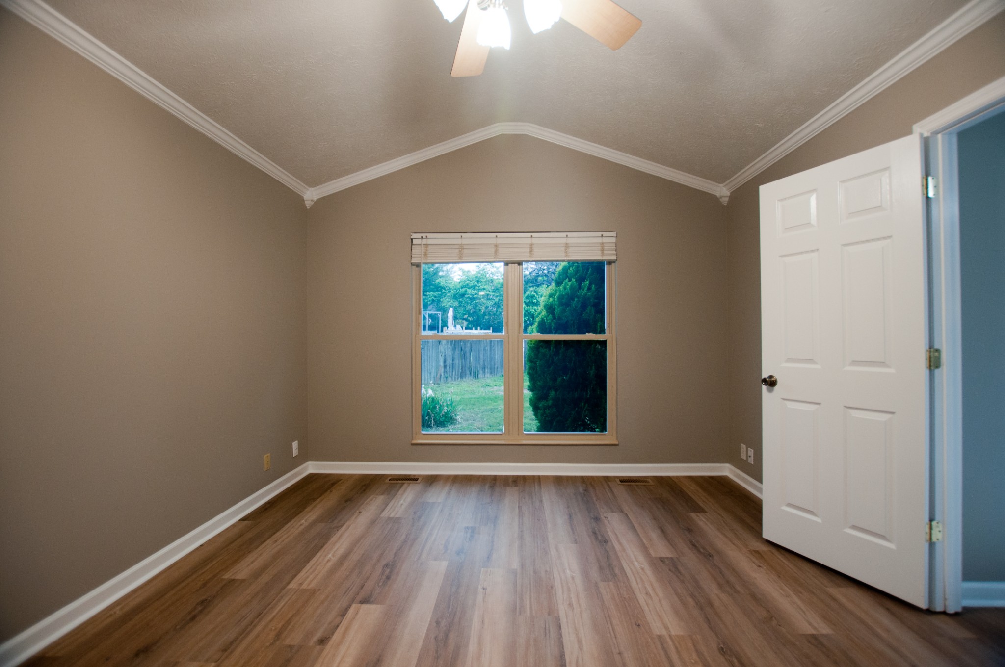 309 Chesterfield Circle Madison, TN 37115 - Photo 19 of 27 an empty room with wooden floor and windows