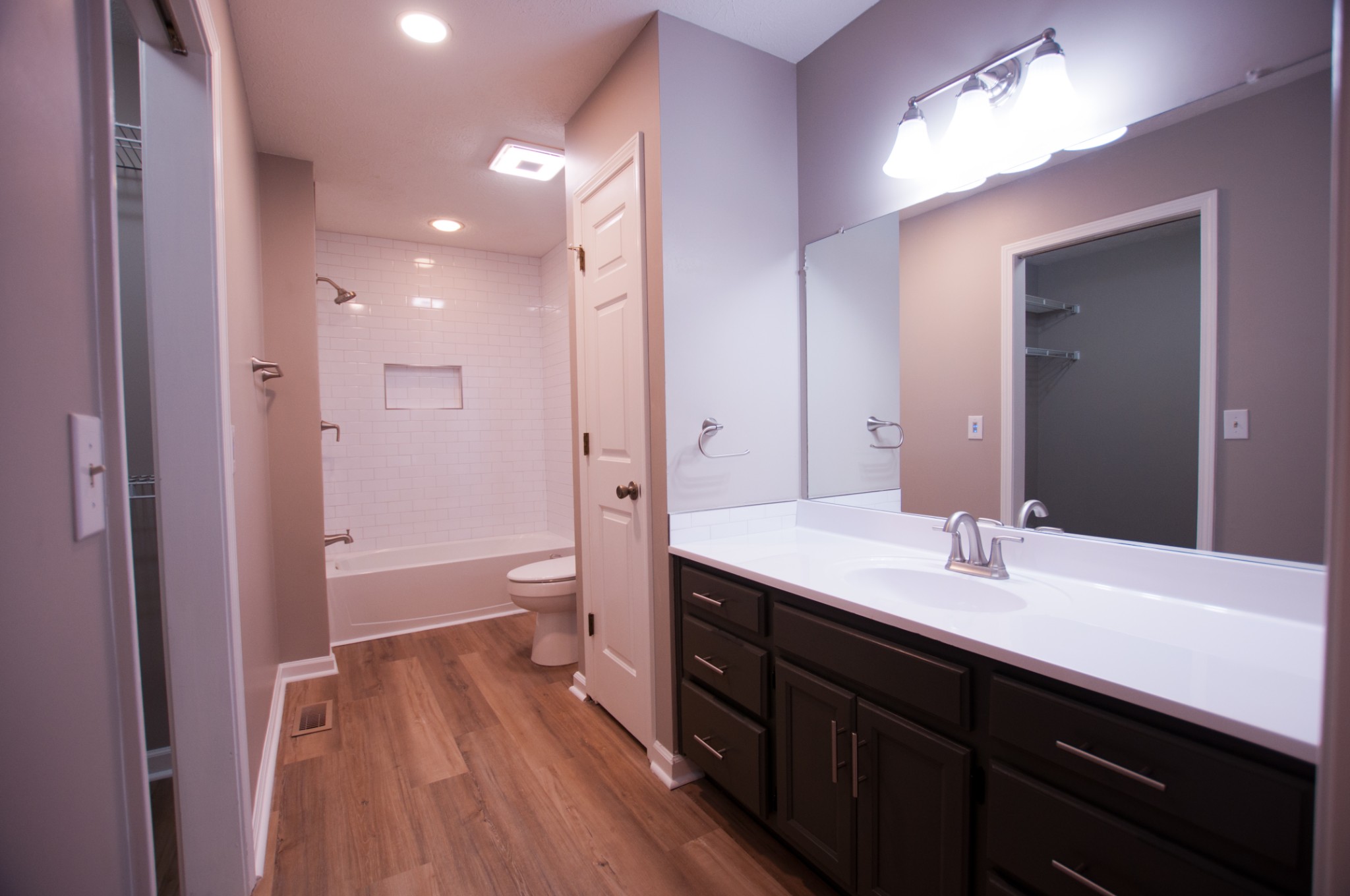 309 Chesterfield Circle Madison, TN 37115 - Photo 22 of 27 a bathroom with a sink a toilet and a large mirror