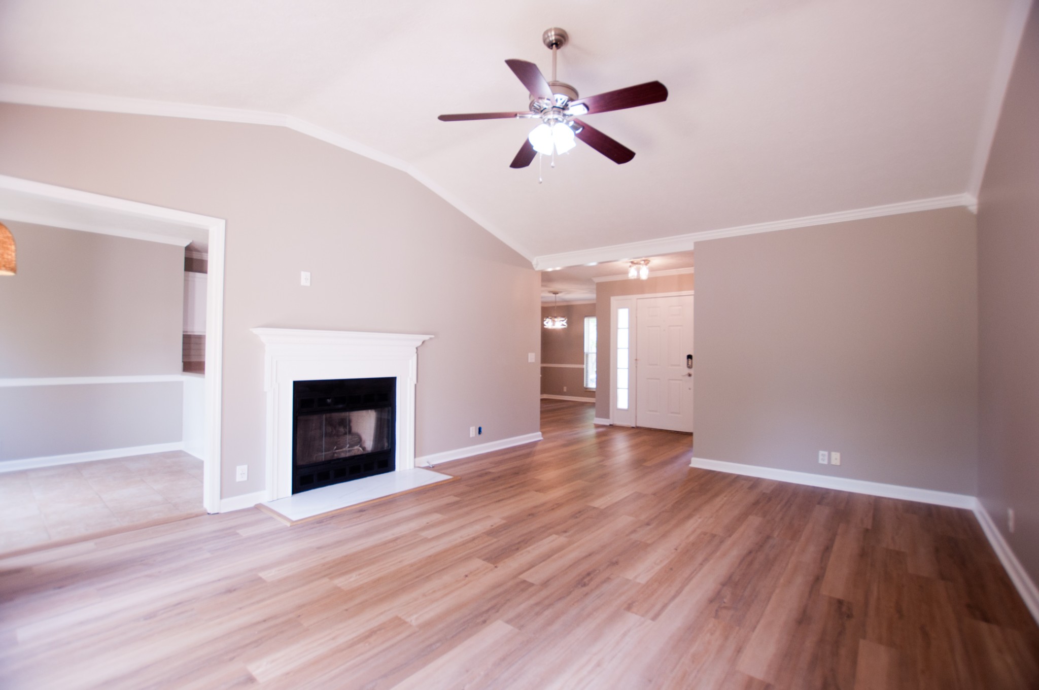 309 Chesterfield Circle Madison, TN 37115 - Photo 7 of 27 wooden floor in an empty room with a fireplace