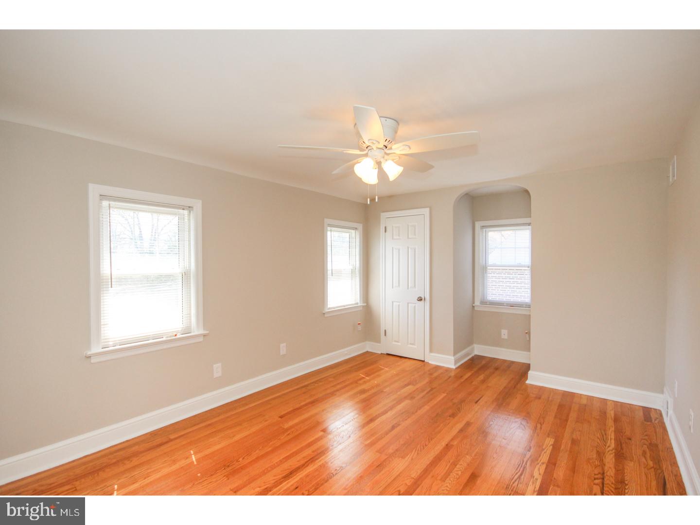 346 Ballymore Road Springfield, PA 19064 - Photo 11 of 24 a view of an empty room with wooden floor and a window