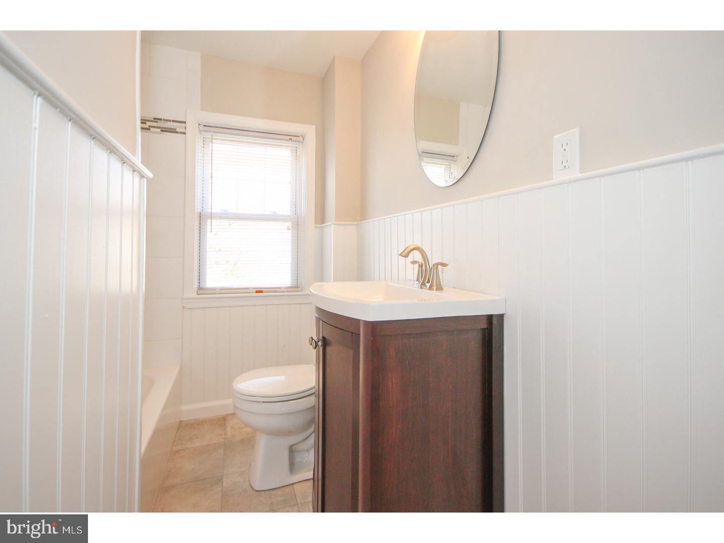 346 Ballymore Road Springfield, PA 19064 - Photo 14 of 24 a bathroom with a sink a toilet and a mirror