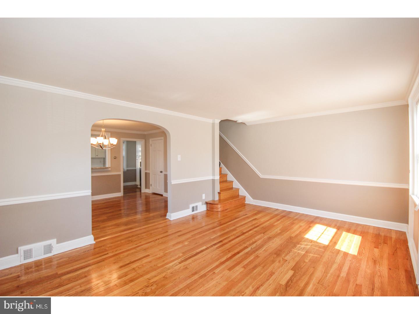 346 Ballymore Road Springfield, PA 19064 - Photo 5 of 24 a view of an empty room with wooden floor