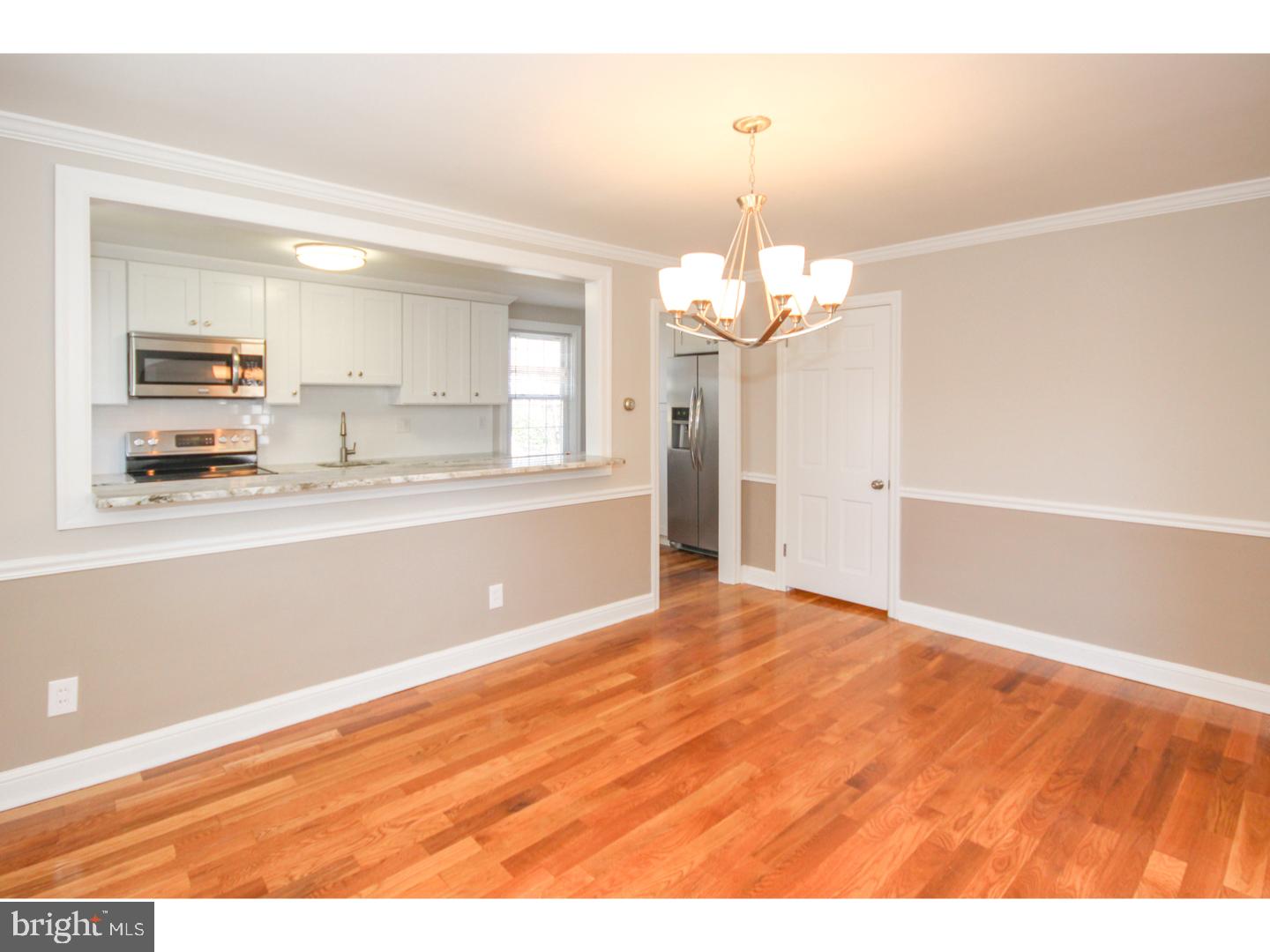 346 Ballymore Road Springfield, PA 19064 - Photo 7 of 24 a view of a kitchen with a dishwasher cabinets and a wooden floor