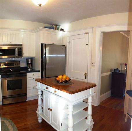 9 Moffatt Road Salem, MA 01970 - Photo 9 of 30 a kitchen with stainless steel appliances granite countertop a sink stove and refrigerator