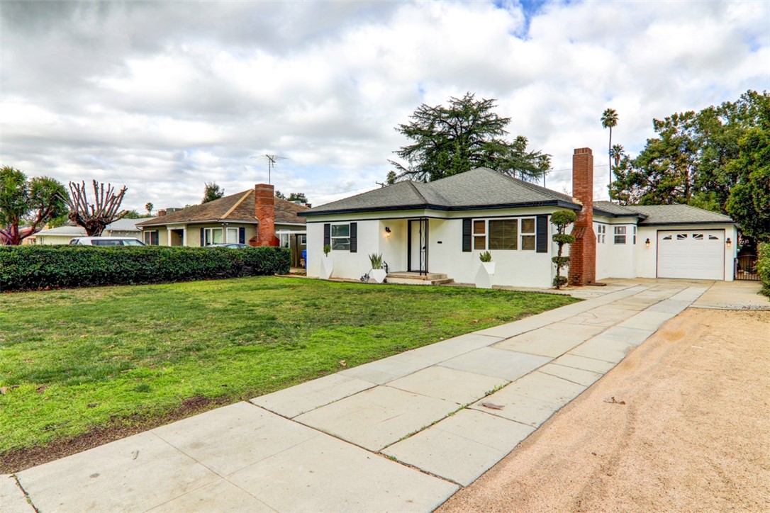 7133 Delaware Street Riverside, CA 92504 - Photo 1 of 1 a front view of a house with a garden
