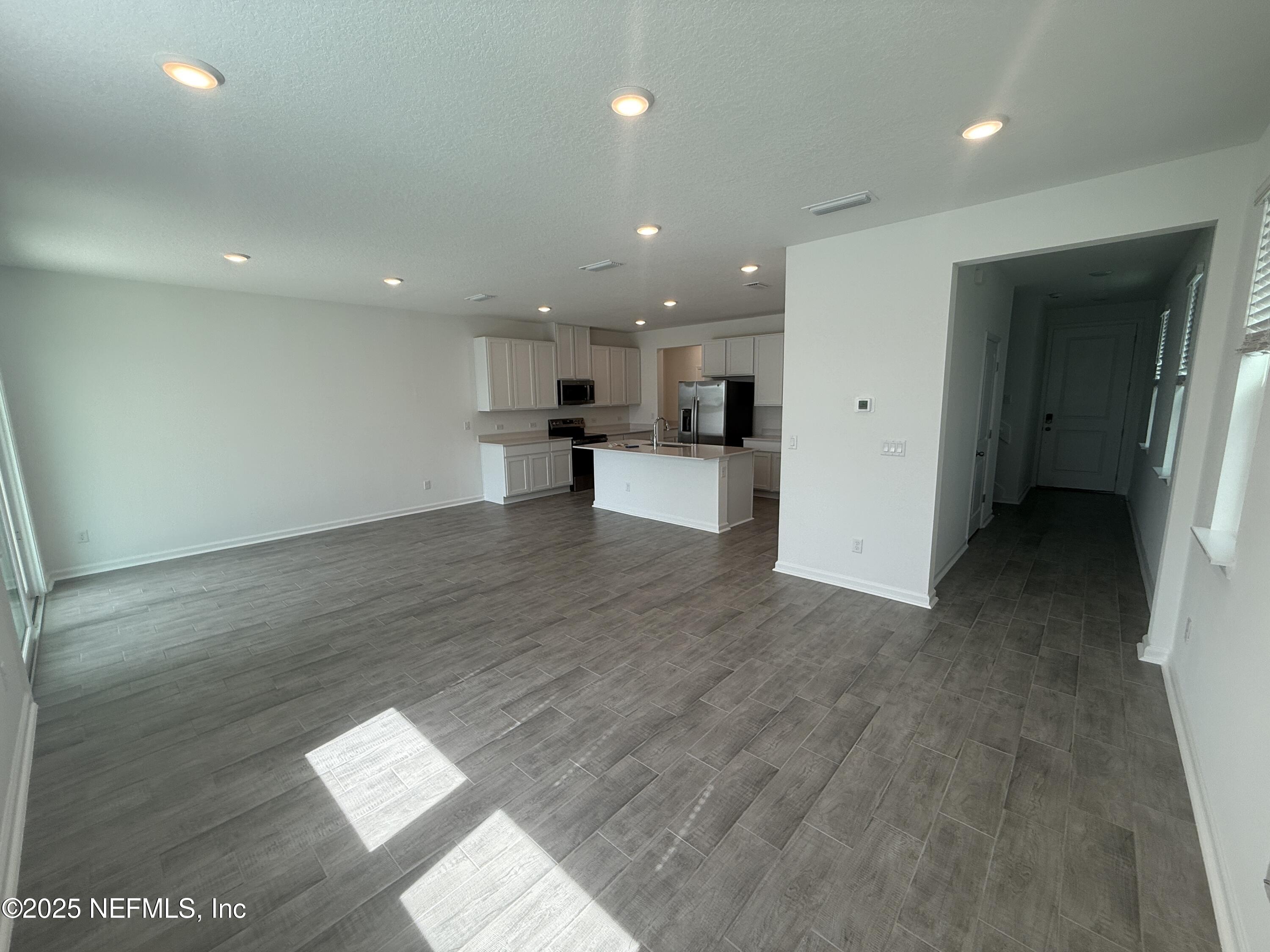 6850 Rhapsody Road Jacksonville, FL 32244 - Photo 10 of 47 LIVING DINING KITCHEN FOYER