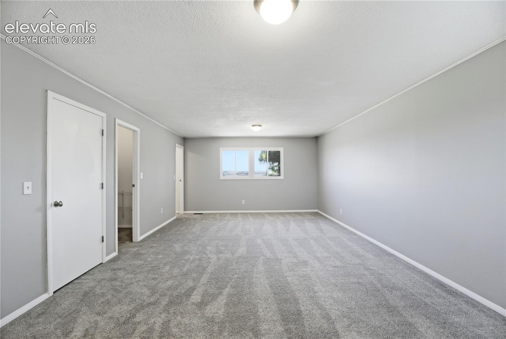 19027 Murphy Road Peyton, CO 80831 - Photo 18 of 49 Carpet, Dual Closets, Primary Bath, Large Room, Windows All Around