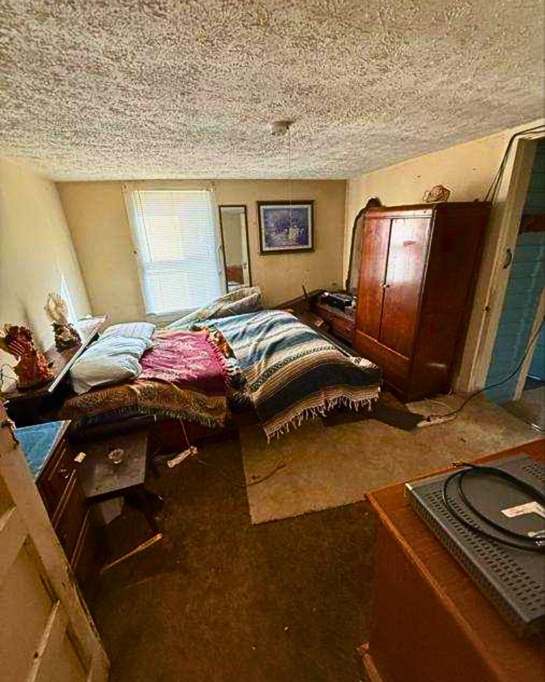 2409 2nd Street Radford, VA 24141 - Photo 10 of 14 a bedroom with a bed and wooden floor