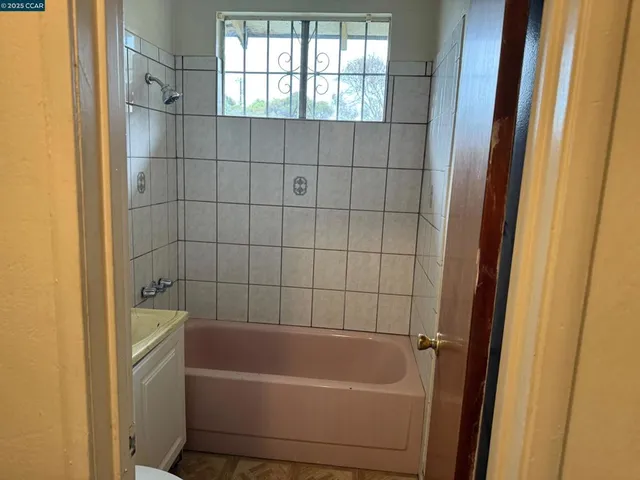 a bathroom with sink toilet and shower