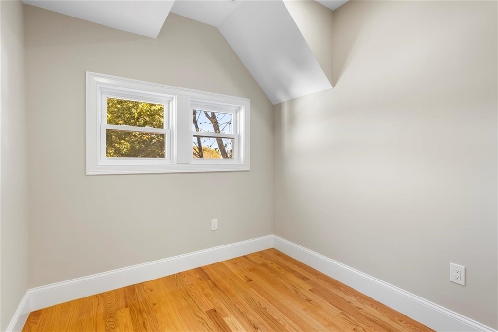 31 Woodale Avenue, Unit 2 Boston, MA 02126 - Photo 13 of 16 a view of a small space with wooden floor and a window