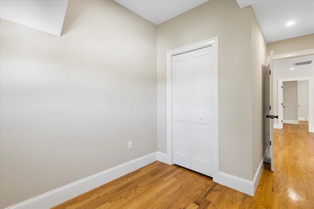 31 Woodale Avenue, Unit 2 Boston, MA 02126 - Photo 14 of 16 a view of small space with wooden floor