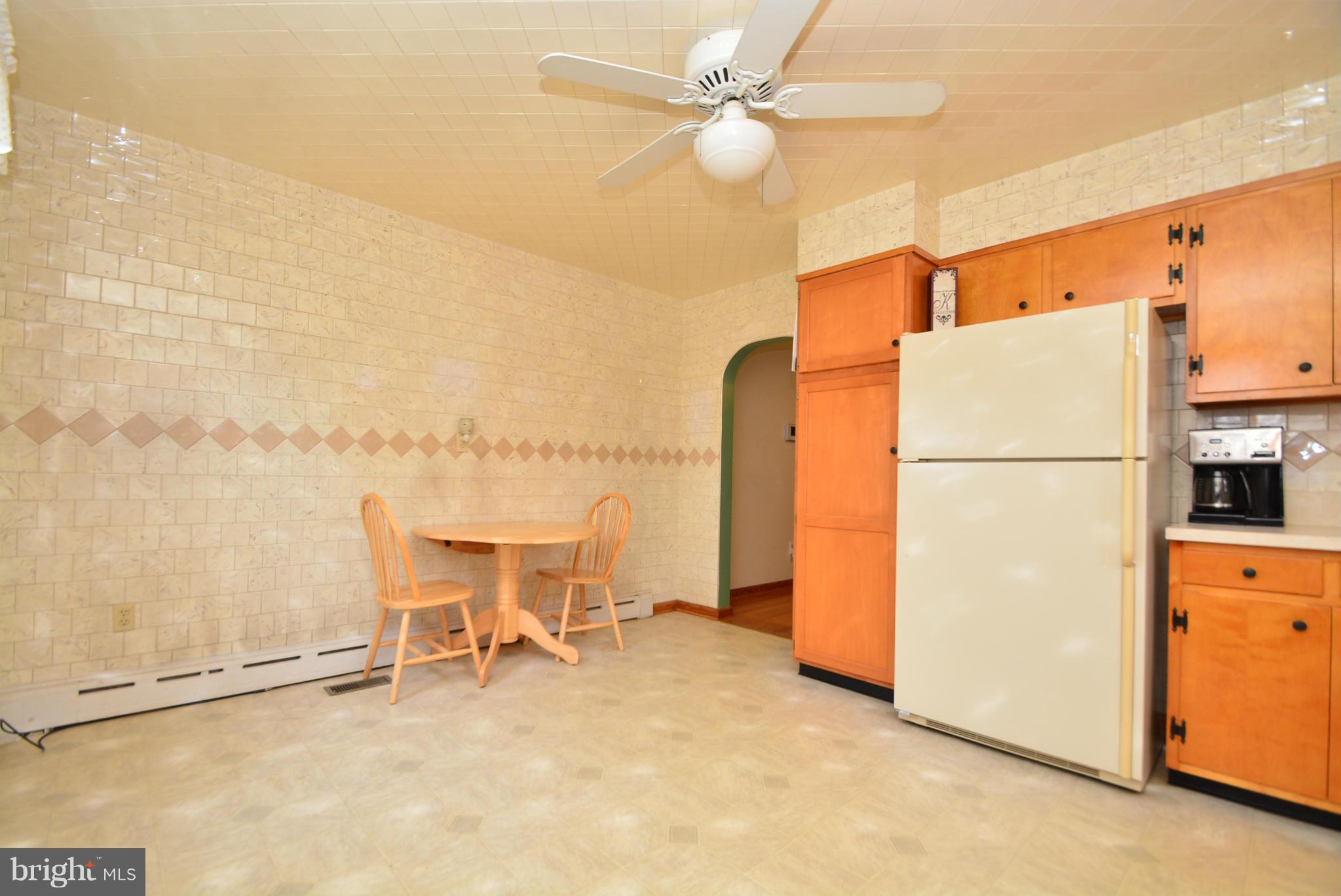 4910 Forge Road Perry Hall, MD 21128 - Photo 11 of 25 a view of a kitchen with a refrigerator and microwave