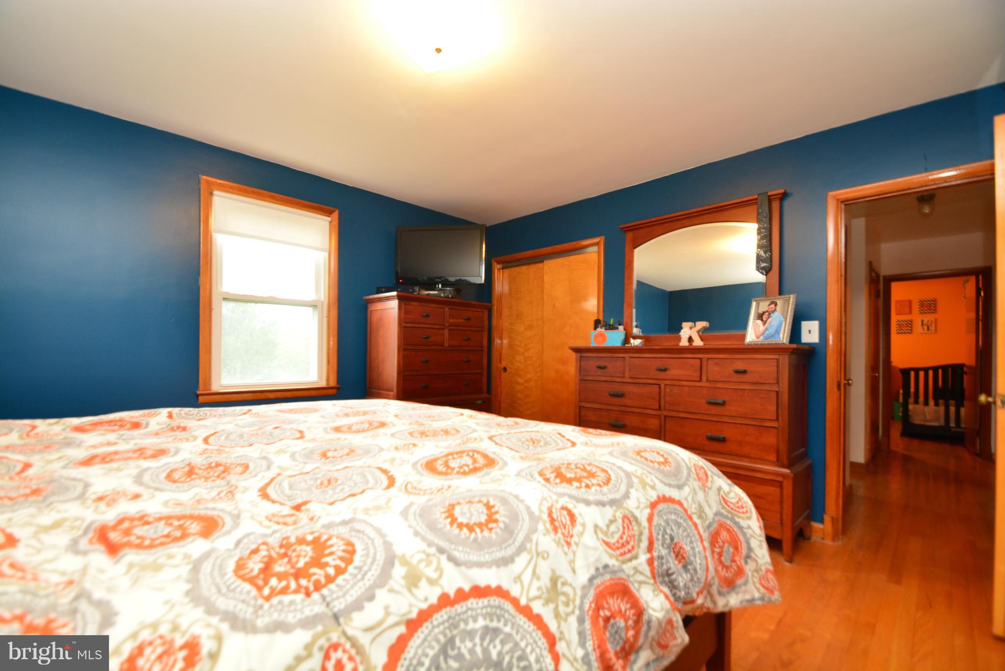 4910 Forge Road Perry Hall, MD 21128 - Photo 13 of 25 a bedroom with a bed and a dresser