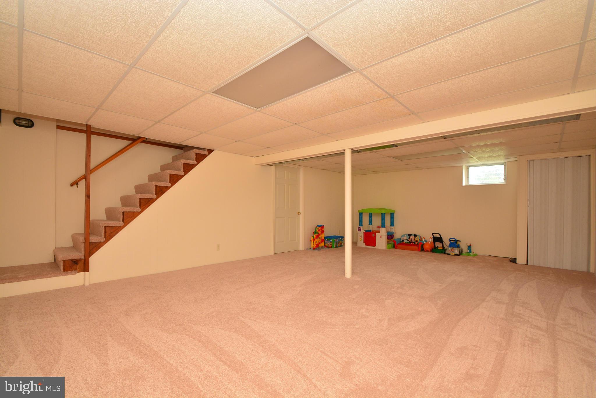 4910 Forge Road Perry Hall, MD 21128 - Photo 21 of 25 a view of an empty room with stairs