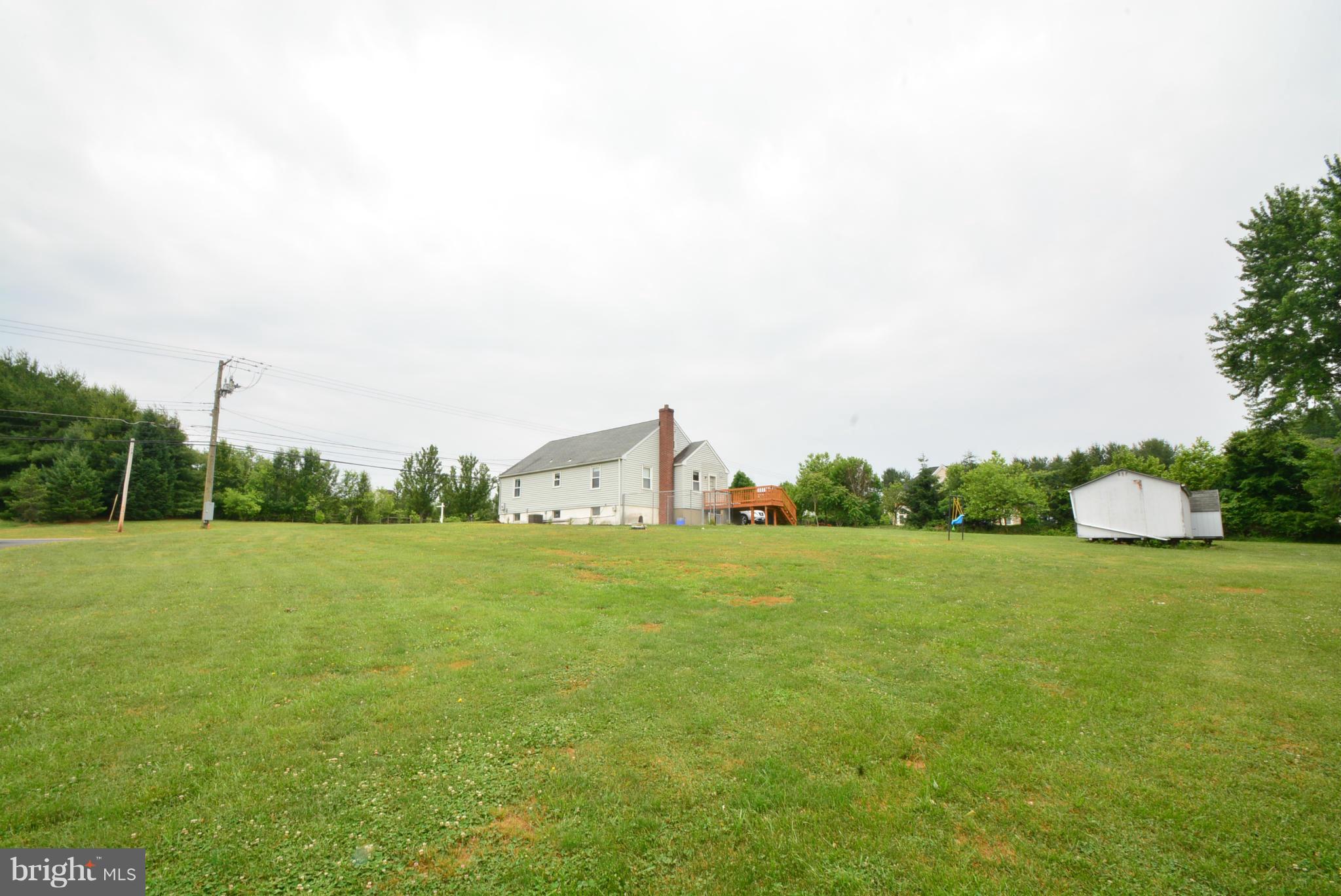 4910 Forge Road Perry Hall, MD 21128 - Photo 24 of 25 a view of a field with a big yard and a large trees