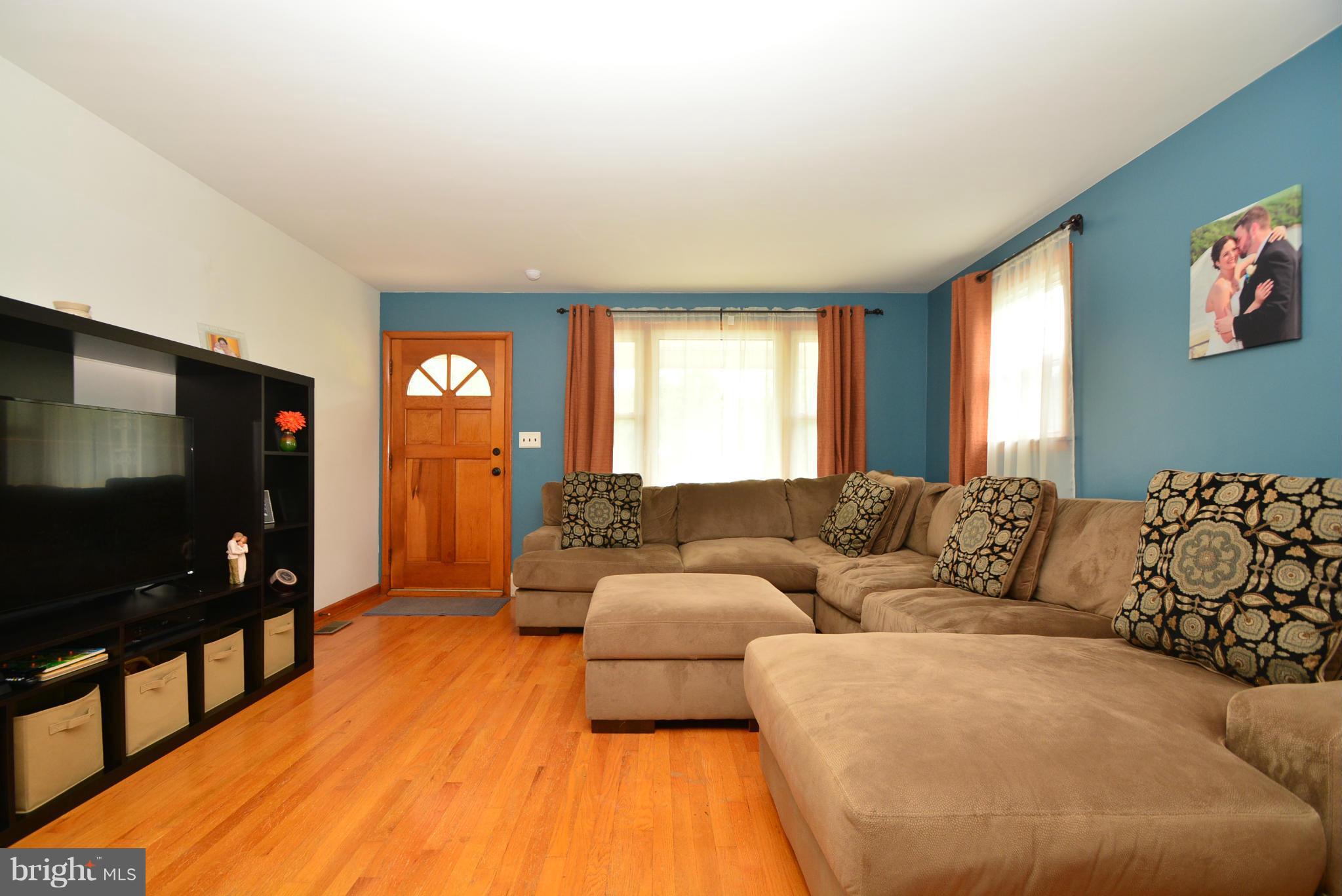 4910 Forge Road Perry Hall, MD 21128 - Photo 4 of 25 a living room with furniture and a flat screen tv