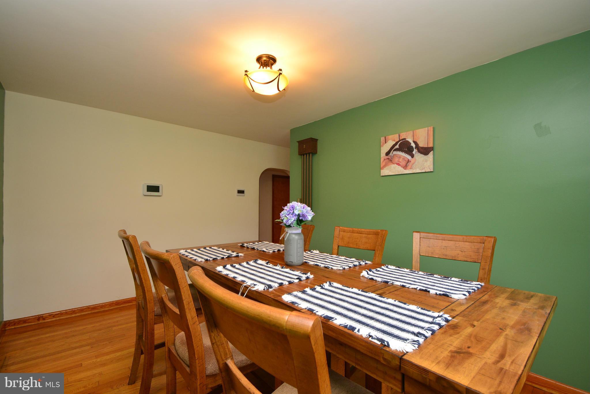 4910 Forge Road Perry Hall, MD 21128 - Photo 6 of 25 a view of a dining room with a table and chairs