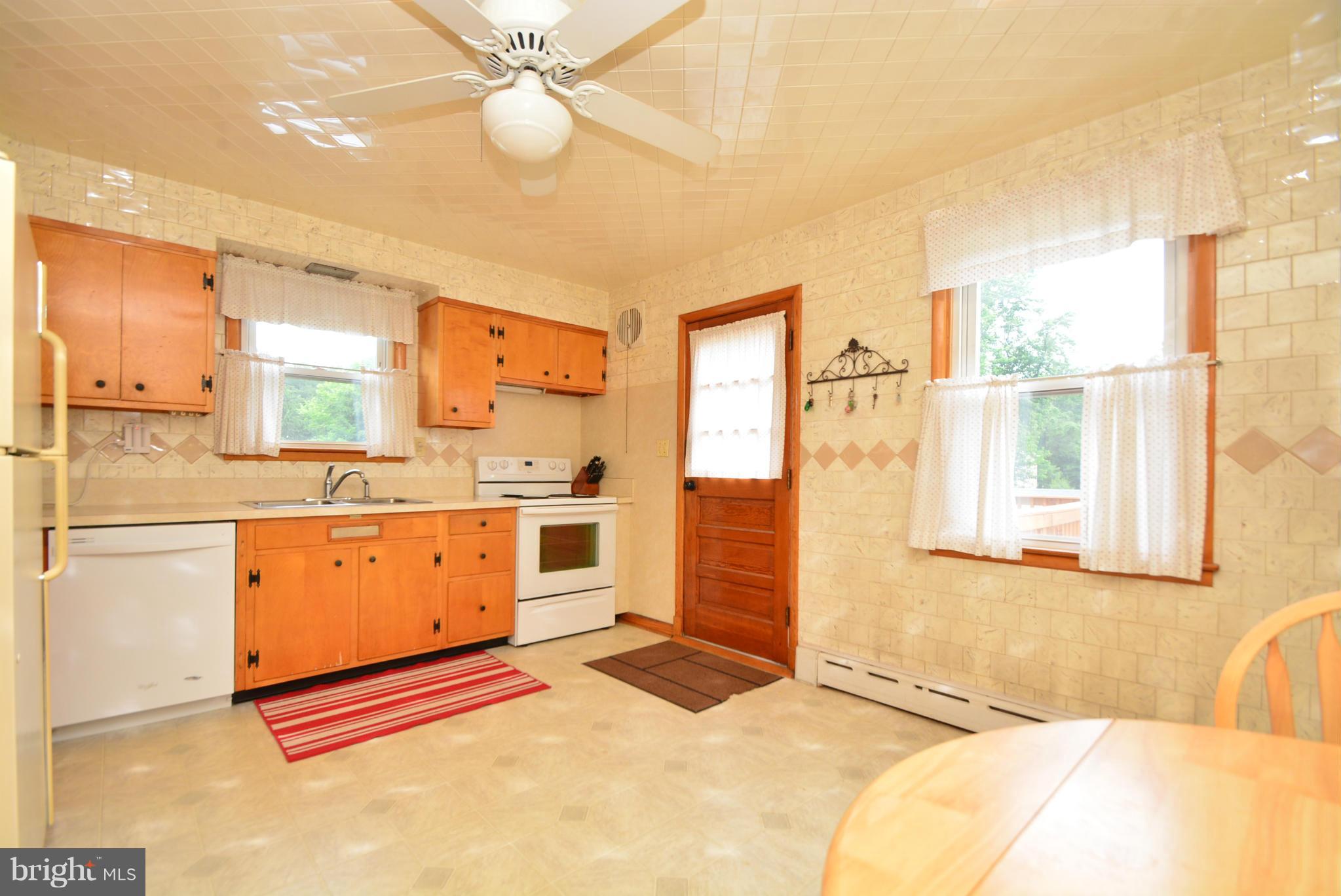 4910 Forge Road Perry Hall, MD 21128 - Photo 9 of 25 a spacious bathroom with a granite countertop sink mirror and a bathtub