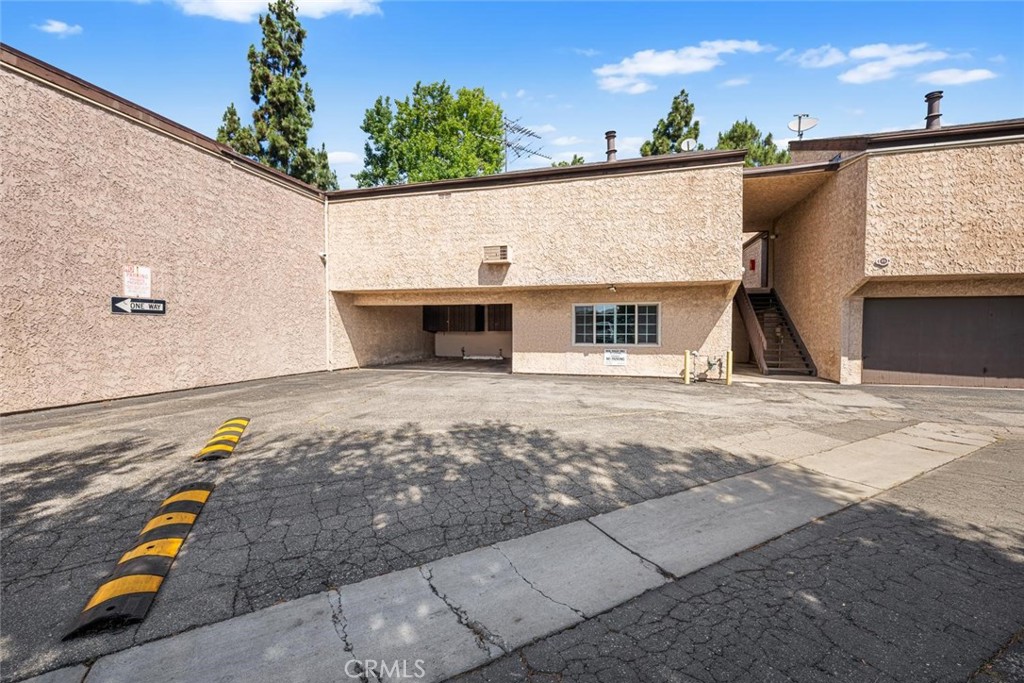 7890 East Spring Street, Unit 15D Long Beach, CA 90815 - Photo 30 of 40 Building right of the carport is your laundry room