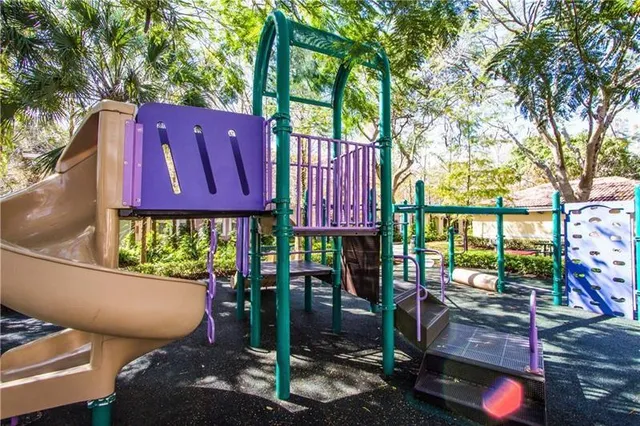 a view of a chairs and table in a backyard