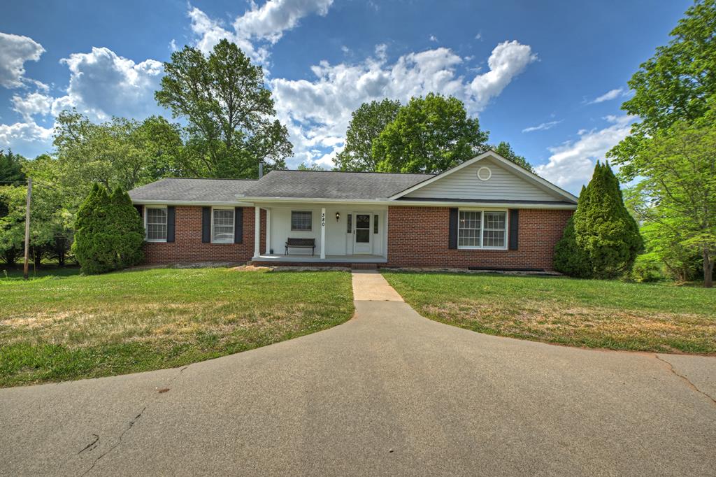 380 La Vista Drive Blue Ridge, GA 30513 - Photo 22 of 48 a front view of a house with a yard and garage