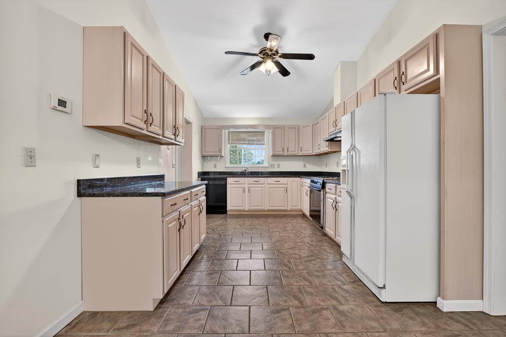 380 La Vista Drive Blue Ridge, GA 30513 - Photo 33 of 48 a kitchen with stainless steel appliances granite countertop a refrigerator and a sink