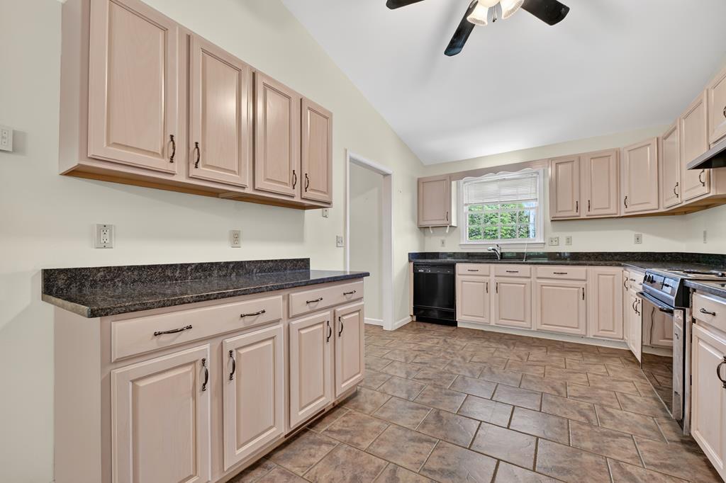 380 La Vista Drive Blue Ridge, GA 30513 - Photo 34 of 48 a kitchen with granite countertop white cabinets stainless steel appliances a sink and a window