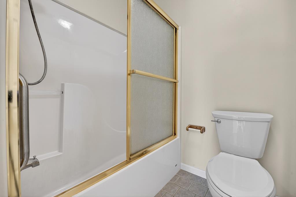 380 La Vista Drive Blue Ridge, GA 30513 - Photo 43 of 48 a bathroom with a toilet and a shower