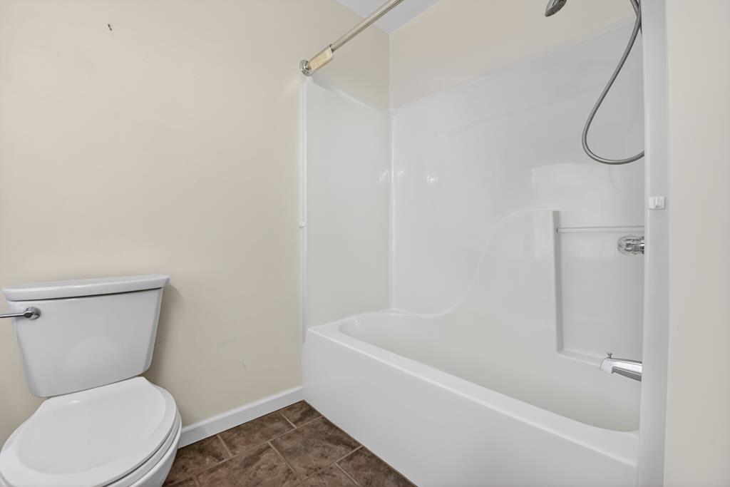 380 La Vista Drive Blue Ridge, GA 30513 - Photo 47 of 48 a white toilet sitting next to a bath tub