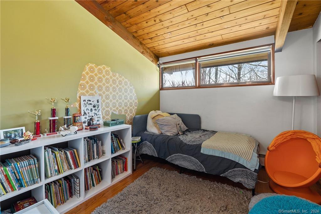 47 Florida Hill Road Ridgefield, CT 06877 - Photo 11 of 29 a living room with furniture and a book shelf