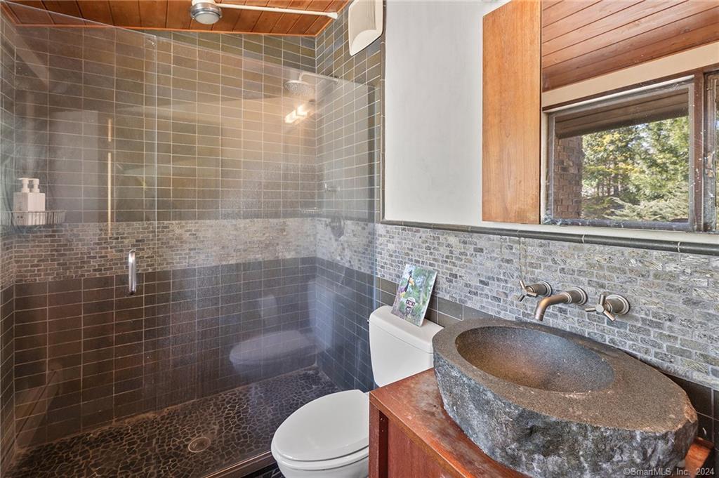 47 Florida Hill Road Ridgefield, CT 06877 - Photo 15 of 29 a bathroom with a sink a toilet and shower