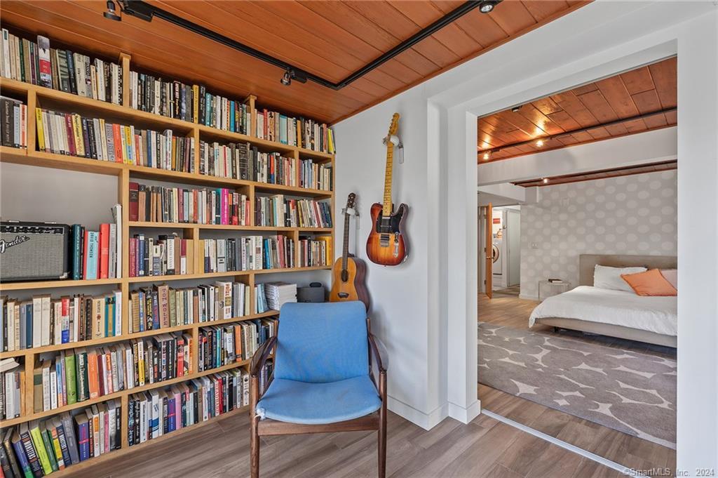 47 Florida Hill Road Ridgefield, CT 06877 - Photo 19 of 29 a bedroom with furniture and a book shelf