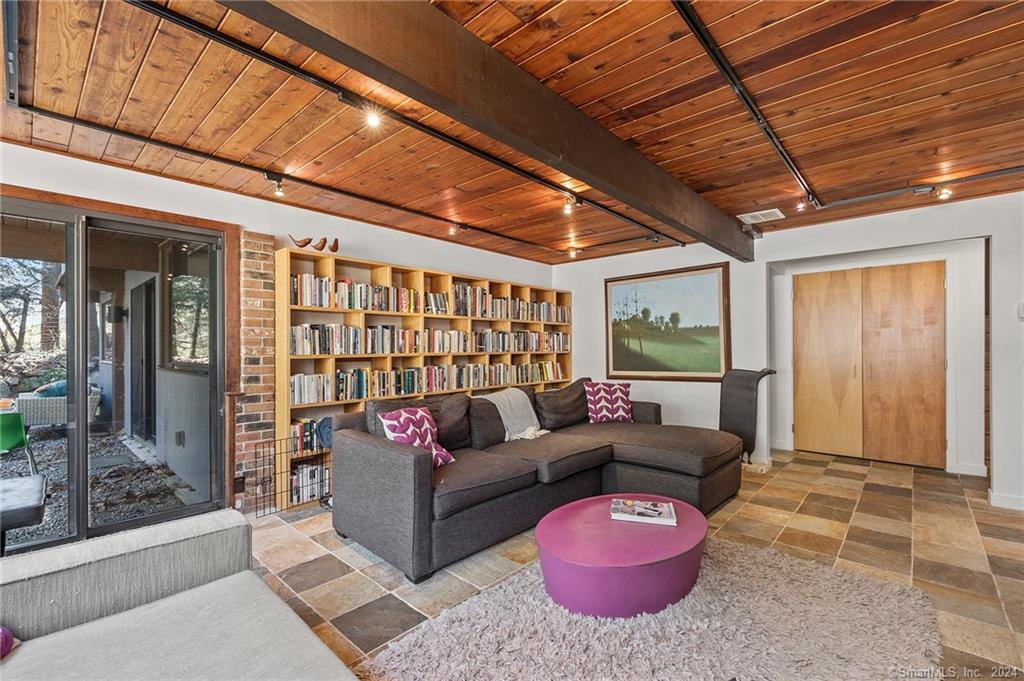 47 Florida Hill Road Ridgefield, CT 06877 - Photo 23 of 29 a living room with furniture a wooden floor and next to a window