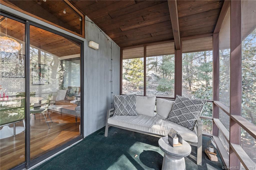 47 Florida Hill Road Ridgefield, CT 06877 - Photo 24 of 29 a living room with furniture and a floor to ceiling window