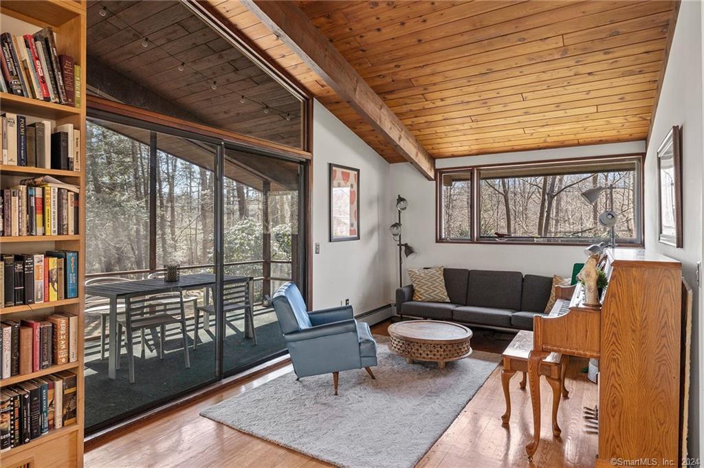 47 Florida Hill Road Ridgefield, CT 06877 - Photo 4 of 29 a living room with furniture a bookshelf and a window