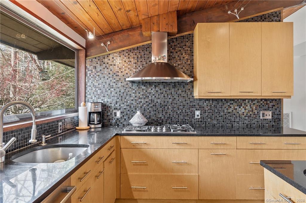 47 Florida Hill Road Ridgefield, CT 06877 - Photo 9 of 29 a kitchen with granite countertop a sink and a wooden cabinets