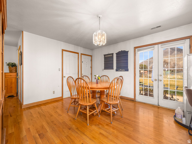 598 West 1600th Street North Mapleton, UT 84664 - Photo 9 of 34 Dining room featuring light wood finished floors, suspended lighting, and french doors