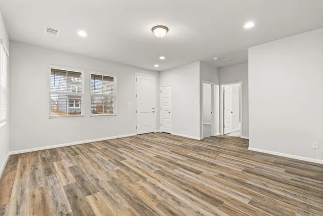 a view of a park with bench and trees