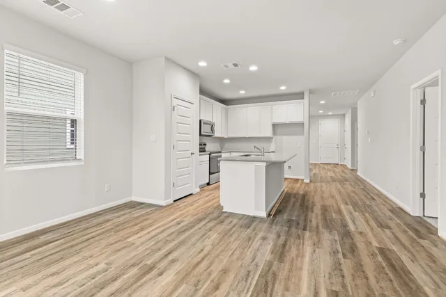 a view of kitchen with wooden floor